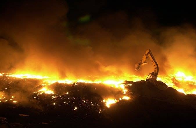 Acres of burning tires contaminate air near Polson, Montana.
